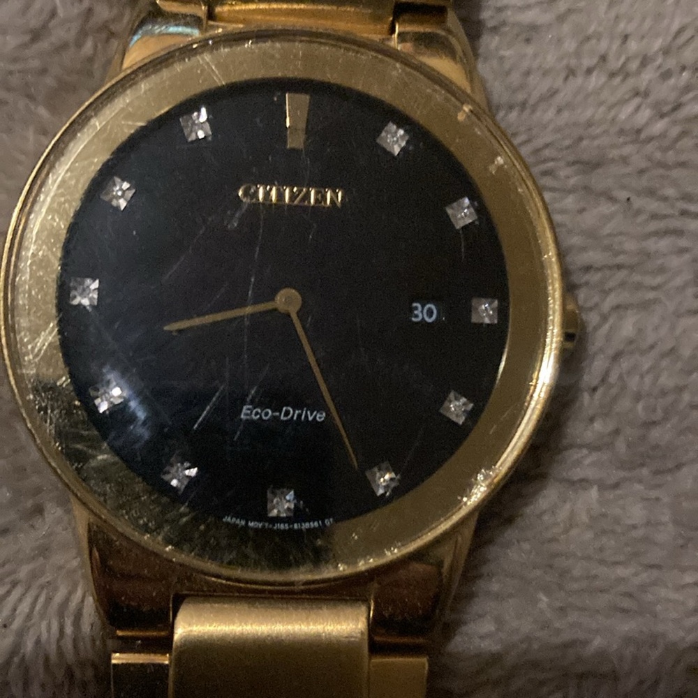 Citizen Gold-Tone Eco-Drive Watch with Black Dial